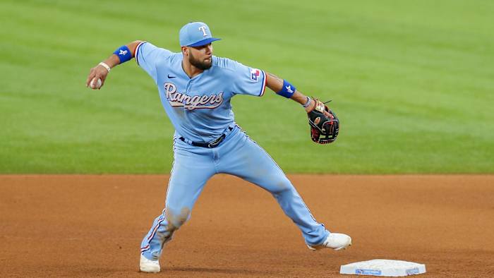 Jun 6, 2021; Arlington, Texas, USA; Texas Rangers third baseman Isiah Kiner-Falefa (9) turns an unassisted double play during the fifth inning against the Tampa Bay Rays at Globe Life Field.